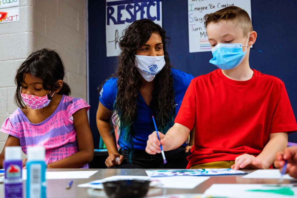 Kids enjoy painting and activities in a safe, healthy environment. Face masks and proper protocol ensure that students stay well.